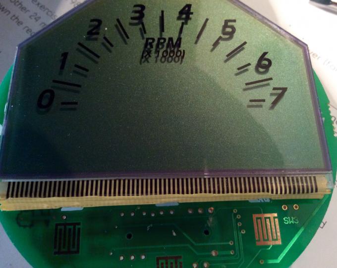 This is the ribbon cable that provides an electrical connection from the LCD to the electronics. It needs pressure to make a good connection.